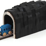 wooden train going through tunnel to the left